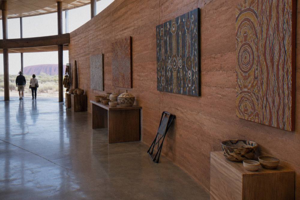 Interior of the Uluru-Kata Tjuta Cultural Centre with art displays and information panels