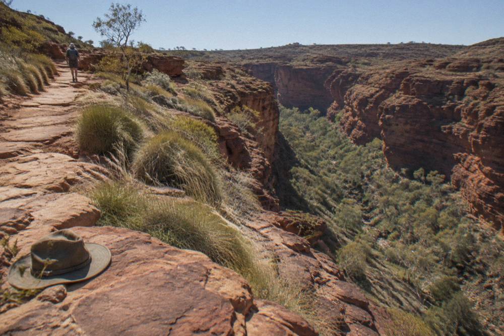 Sandstone rim pathway above the canyon with the valley below