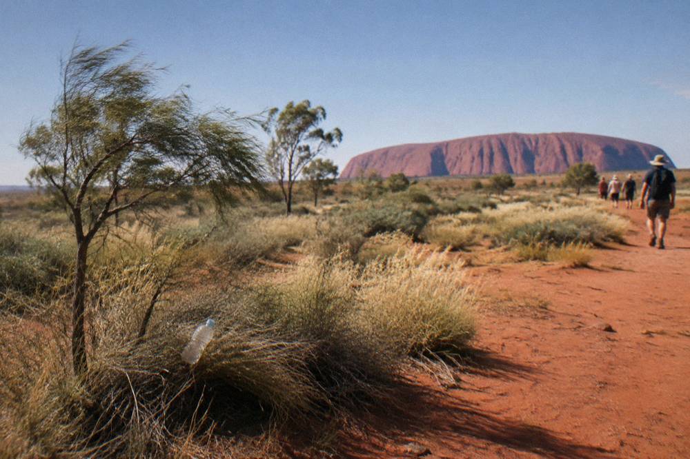 Desert plain and low dunes under a wide open sky near Yulara