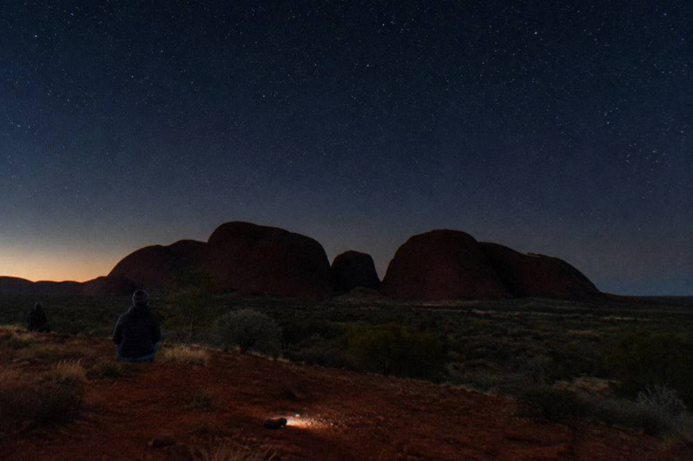 Desert dune lookout outside the park under a starry night sky after sunset